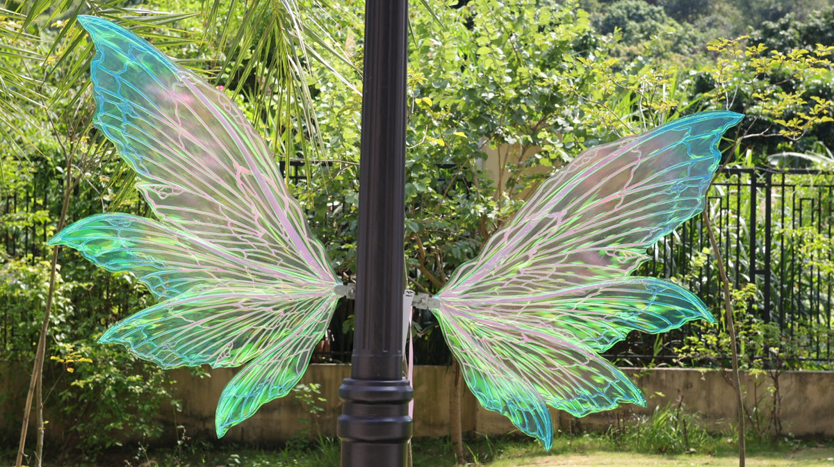 Iridescent blue purple and green color-shifting fairy cosplay wings with shoulder straps and decorative flowers
