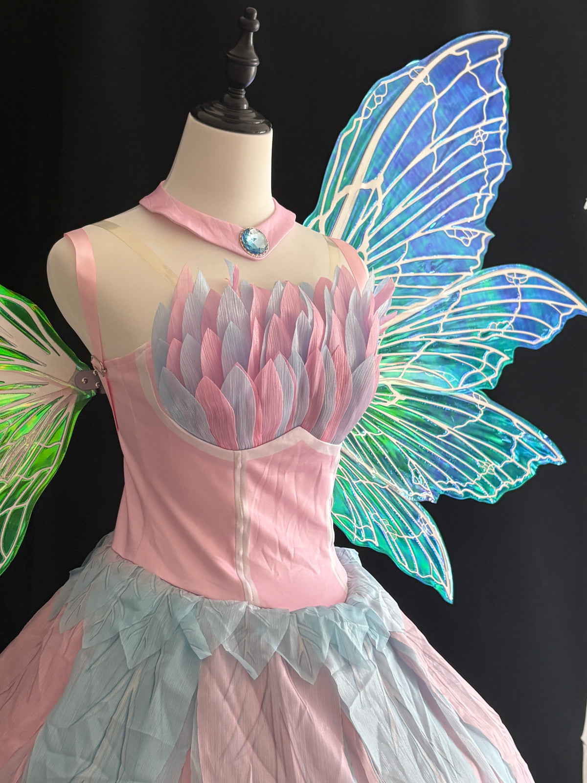 Iridescent blue purple and green color-shifting fairy cosplay wings with shoulder straps and decorative flowers
