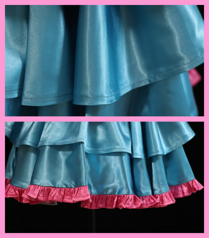 Close-up of the blue satin layered skirt and pink ruffle trim on the Barbie cosplay costume