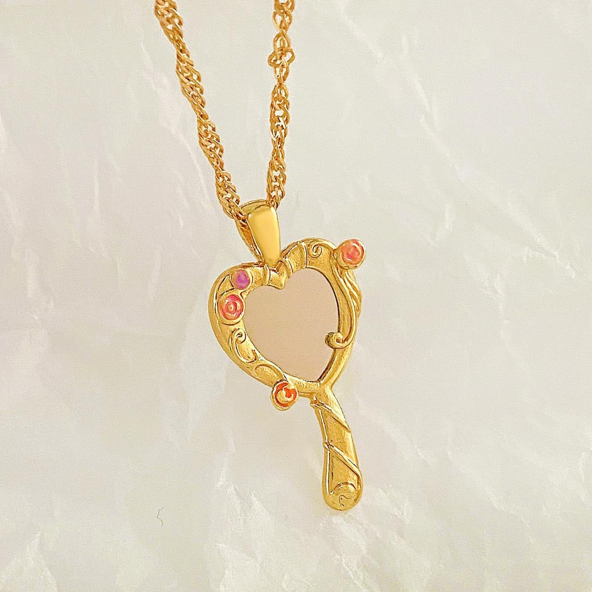 Gold-tone Barbie and the Diamond Castle heart mirror pendant necklace