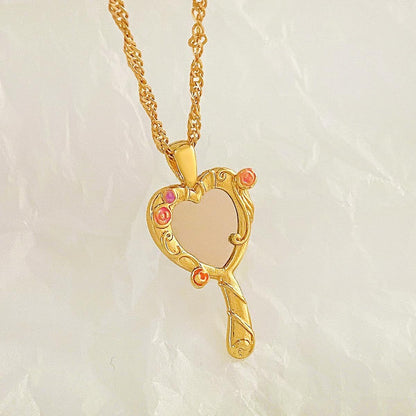 Gold-tone Barbie and the Diamond Castle heart mirror pendant necklace