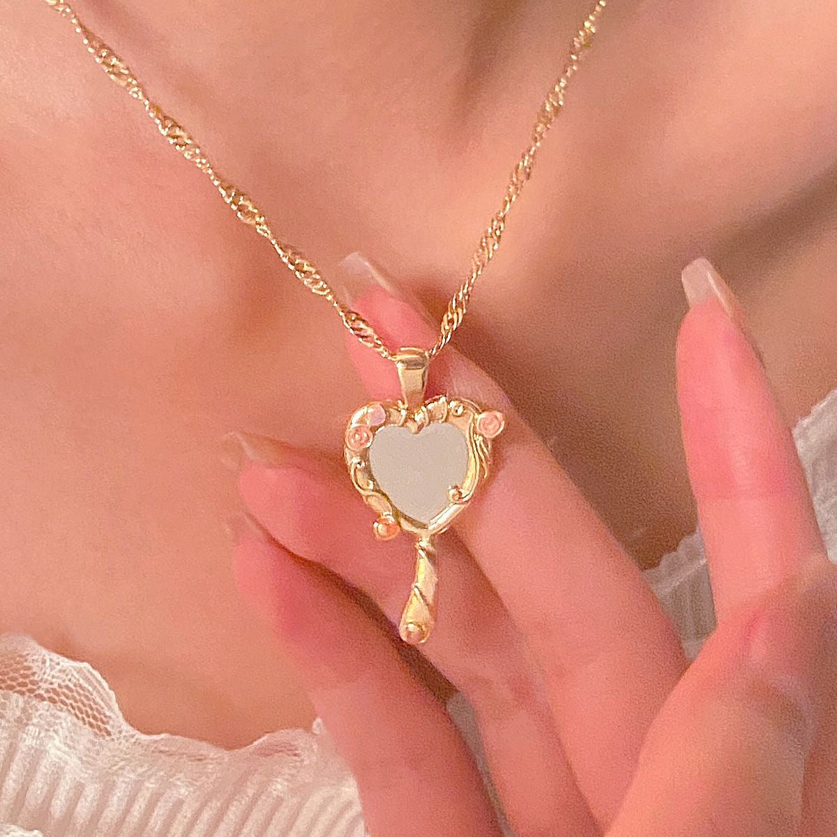 Gold-tone Barbie Diamond Castle heart mirror necklace worn as a cosplay accessory