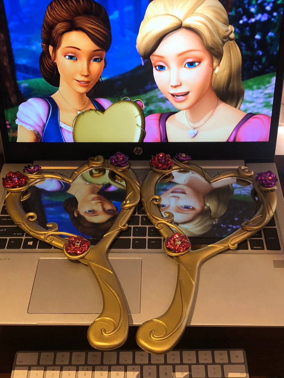 Barbie Diamond Castle heart mirror displayed with Liana and Alexa movie scene