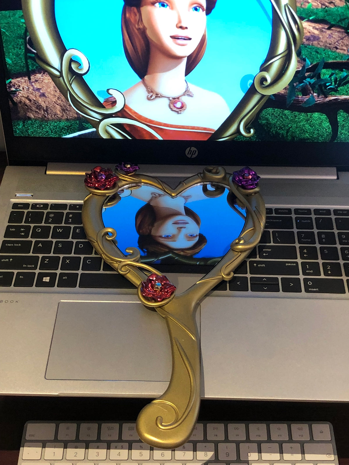 Barbie Diamond Castle heart mirror displayed beside an animated movie scene
