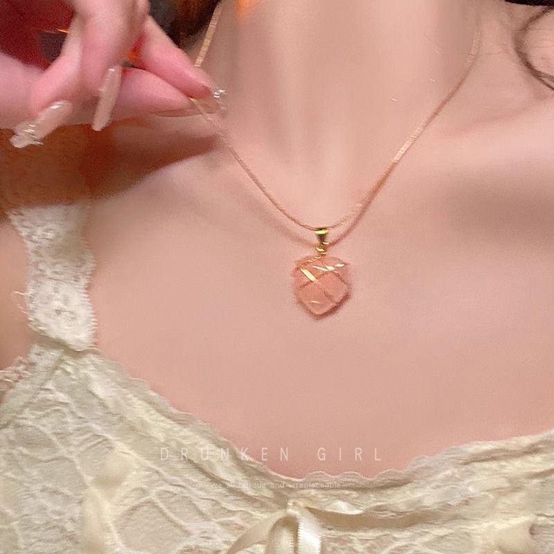 Close-up of the pink heart pendant on the Barbie Diamond Castle necklace