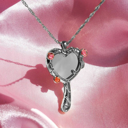 Close-up of the silver-tone Diamond Castle heart mirror pendant necklace