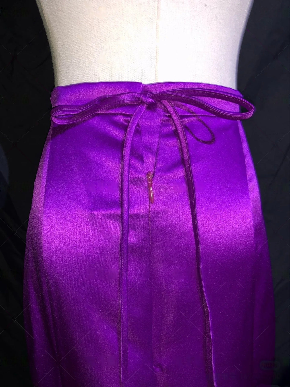 Close up detail of Barbie Fairy Secret gown with purple satin waist design