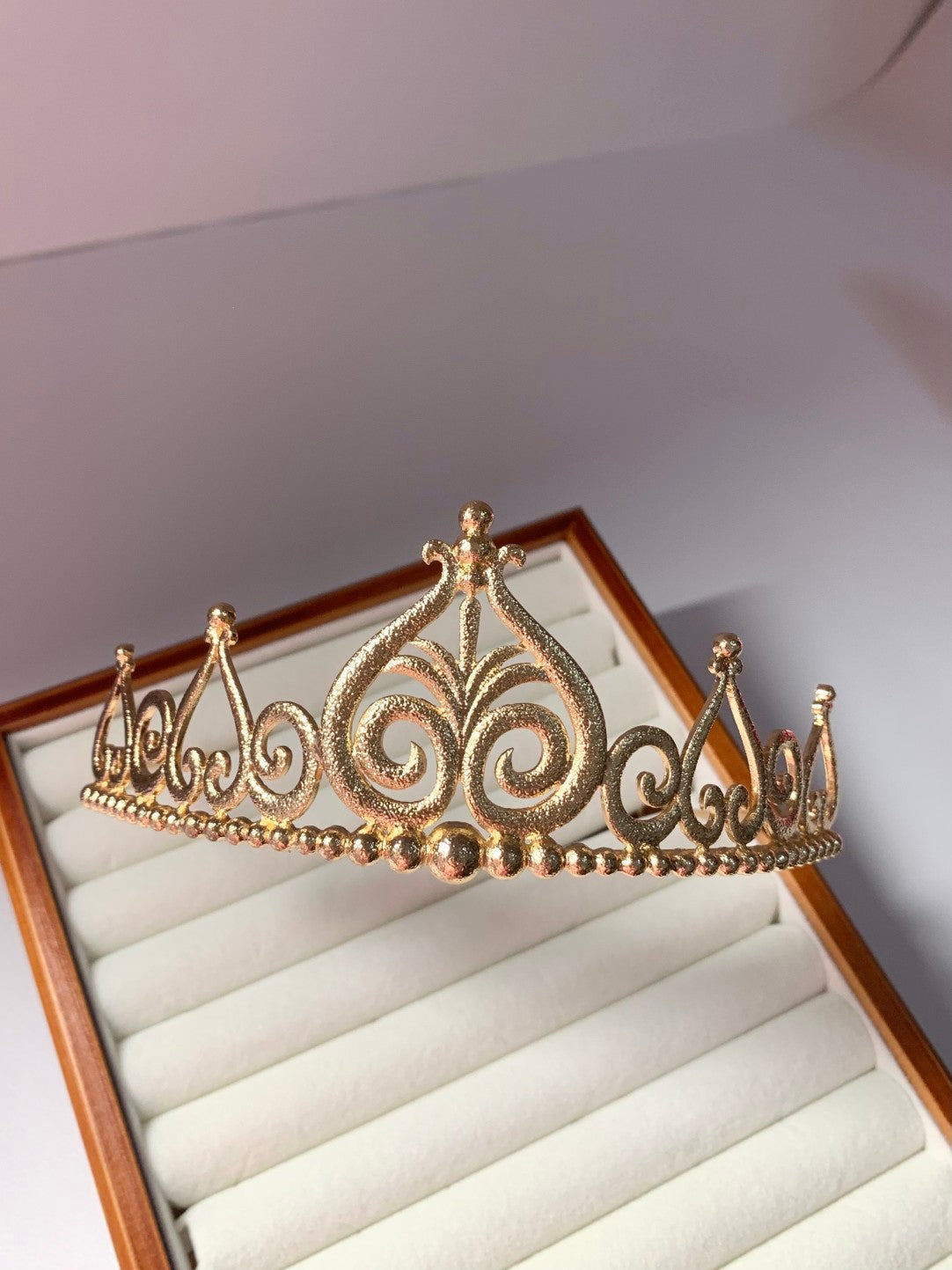 Gold-tone Barbie princess crown with decorative scrollwork design