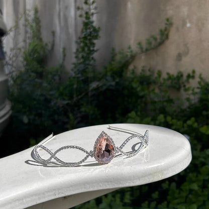 Silver-tone Barbie princess tiara displayed in an outdoor setting