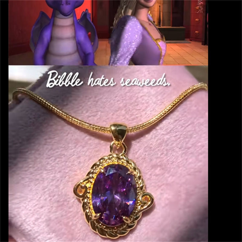 Close-up of Barbie Rapunzel cosplay necklace with a gold-tone frame and purple gemstone