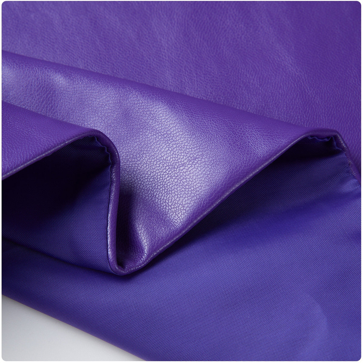 Close-up of the textured purple jacket fabric with a glossy finish