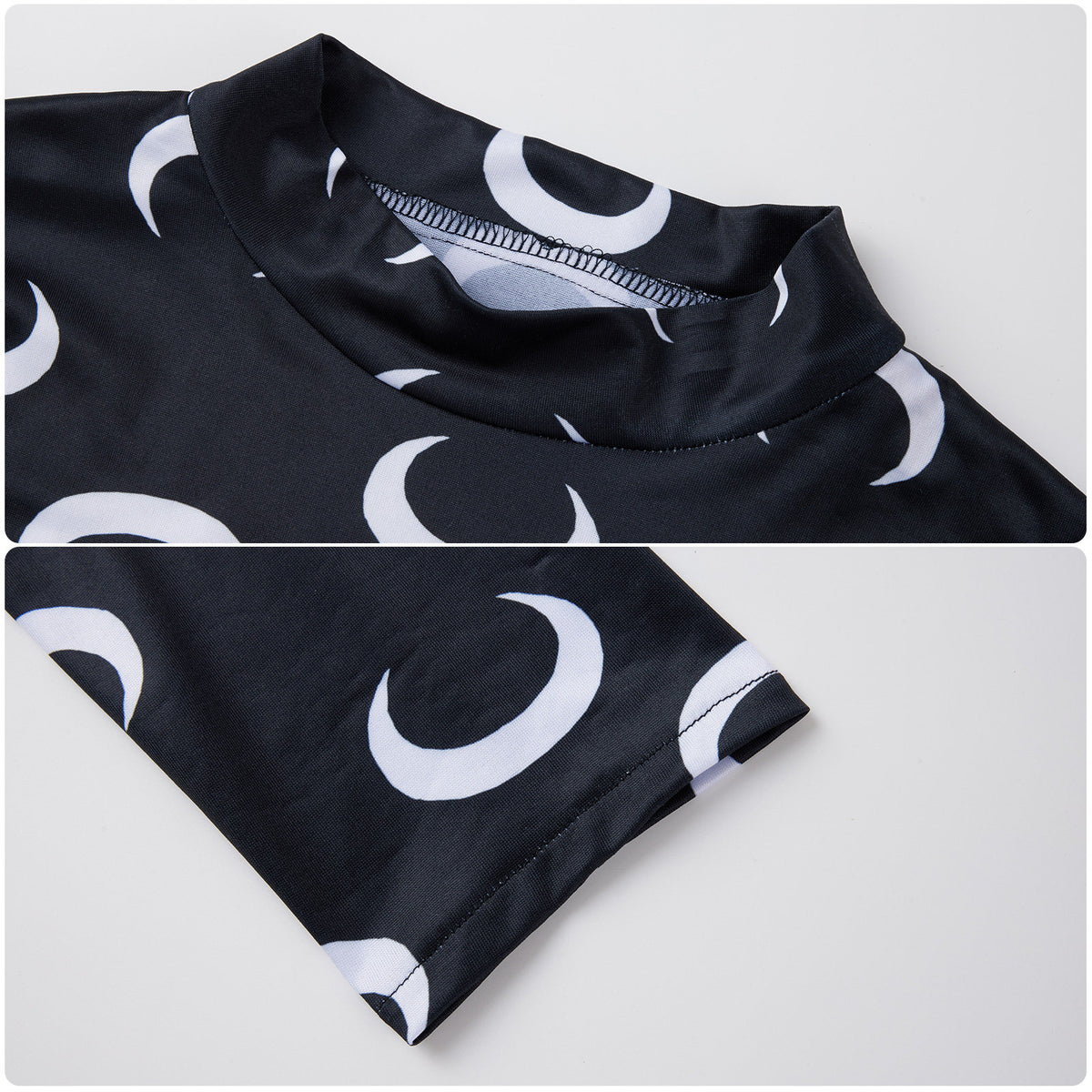Neckline and sleeve hem details of the black top with white crescent moons