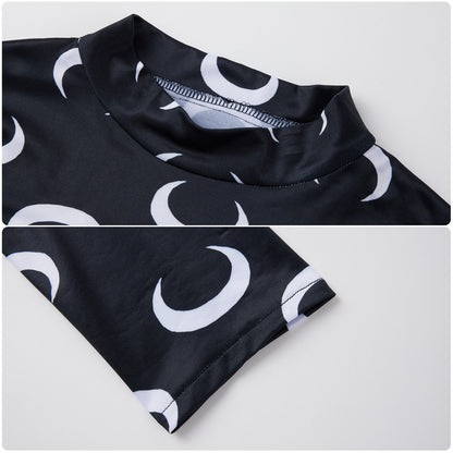 Neckline and sleeve hem details of the black top with white crescent moons