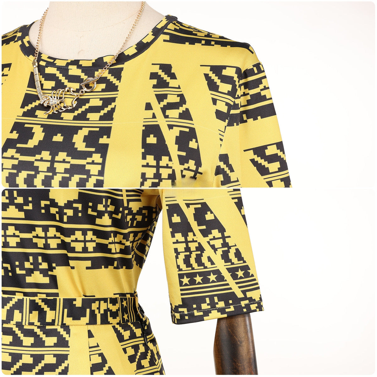 Close-up of the gold and black geometric-print dress neckline and sleeves