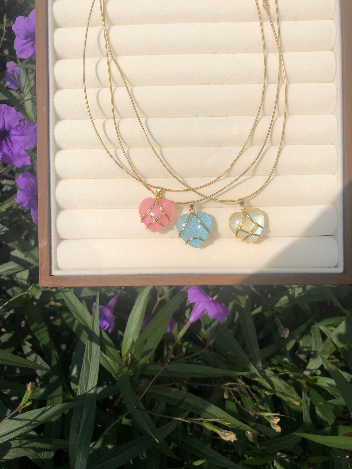 Colorful heart pendant necklaces in pink blue and yellow