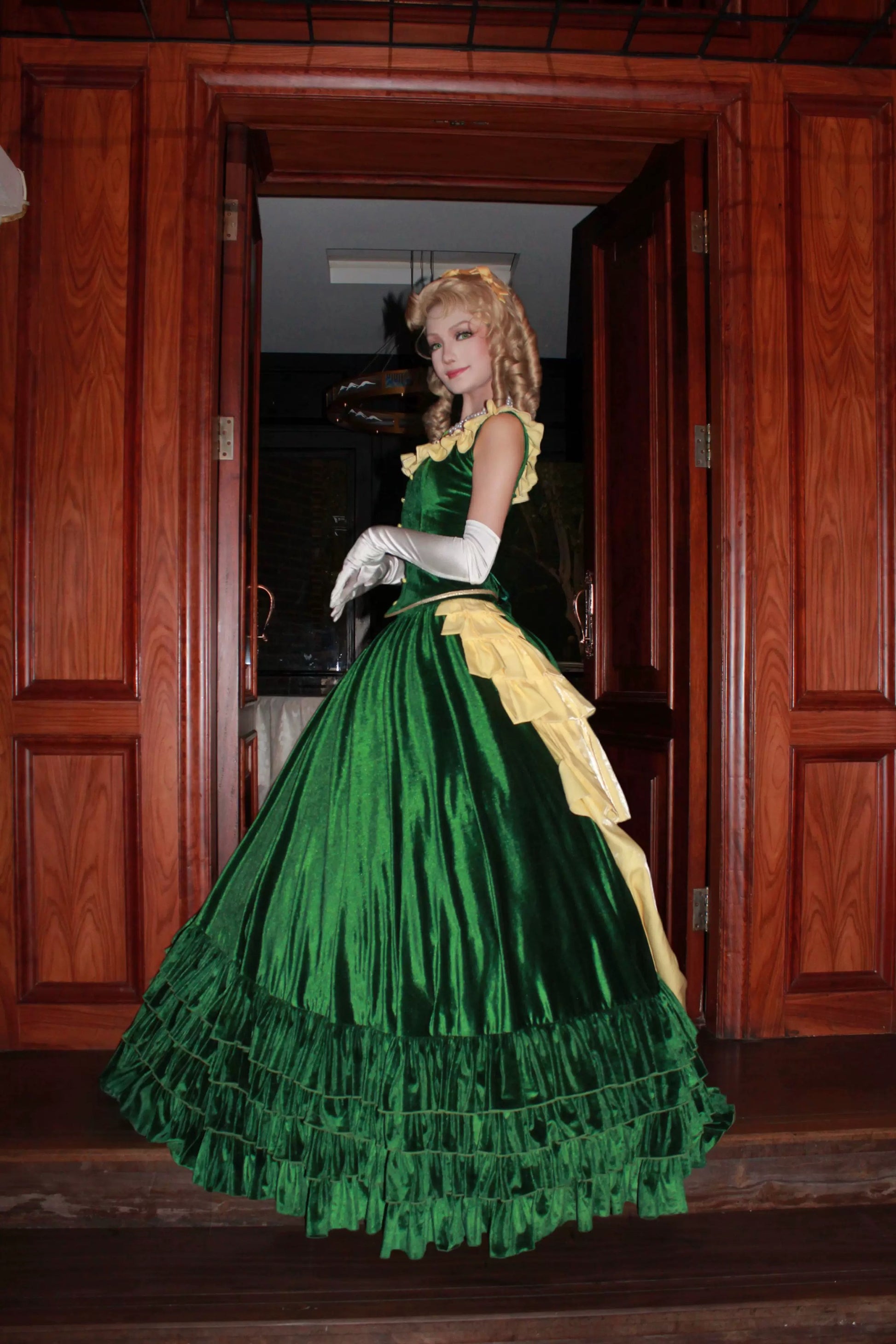 Side view of the Eden Starling Victorian-style green dress