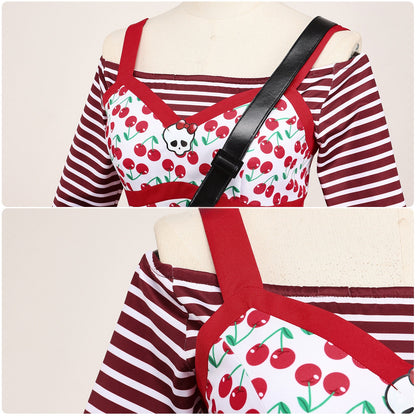 Front and back neckline details of the cherry-print top layered over red and white stripes