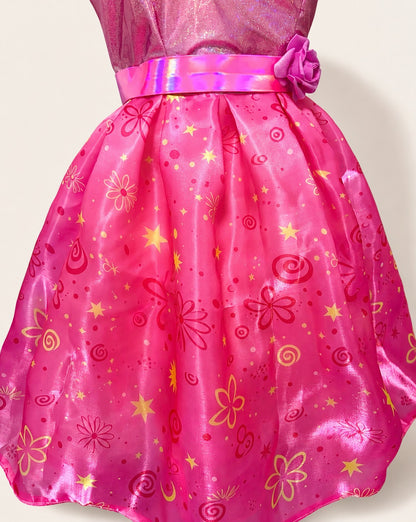 Close-up of the pink skirt with colorful flower, star and swirl patterns