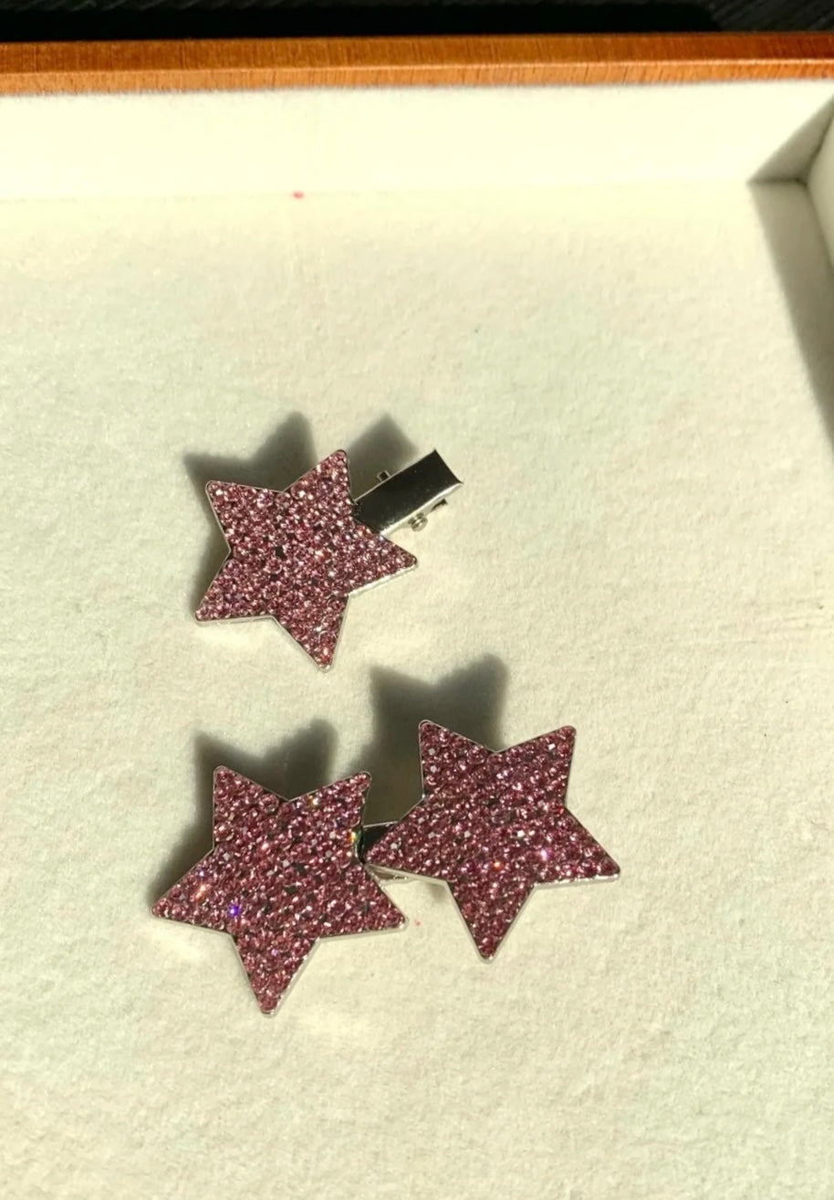 Close-up view of rhinestone star decoration on pink princess cosplay costume
