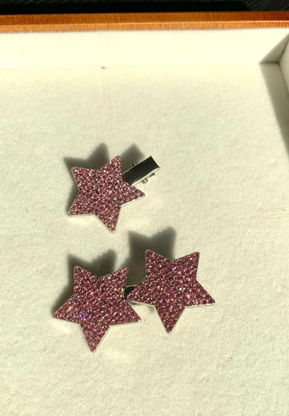Close-up view of rhinestone star decoration on pink princess cosplay costume