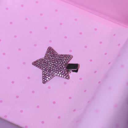 Silver sparkling star hair clip detail