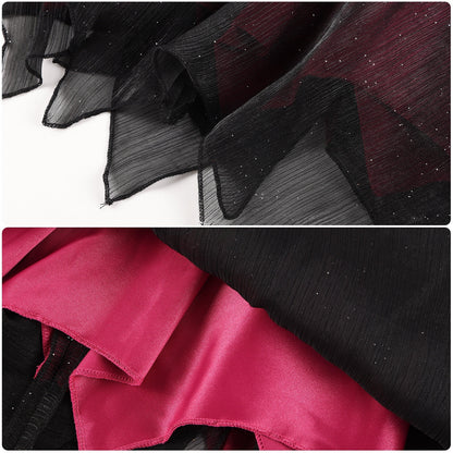 Close-up of the pointed black mesh skirt hem and contrasting pink and black fabrics