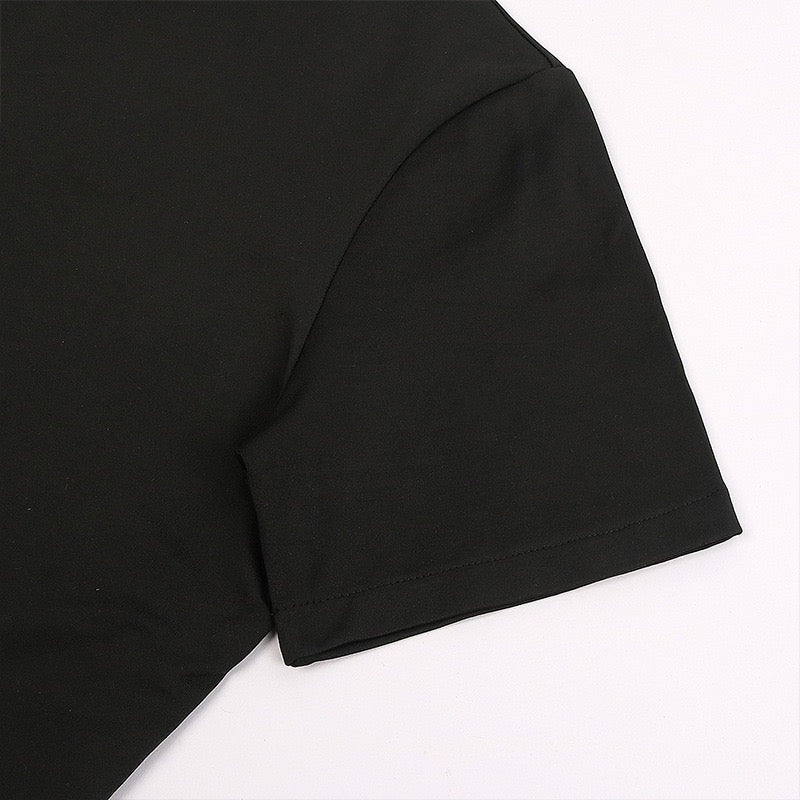 Close-up of the sleeve and stitching on the black Toji Fushiguro cosplay shirt