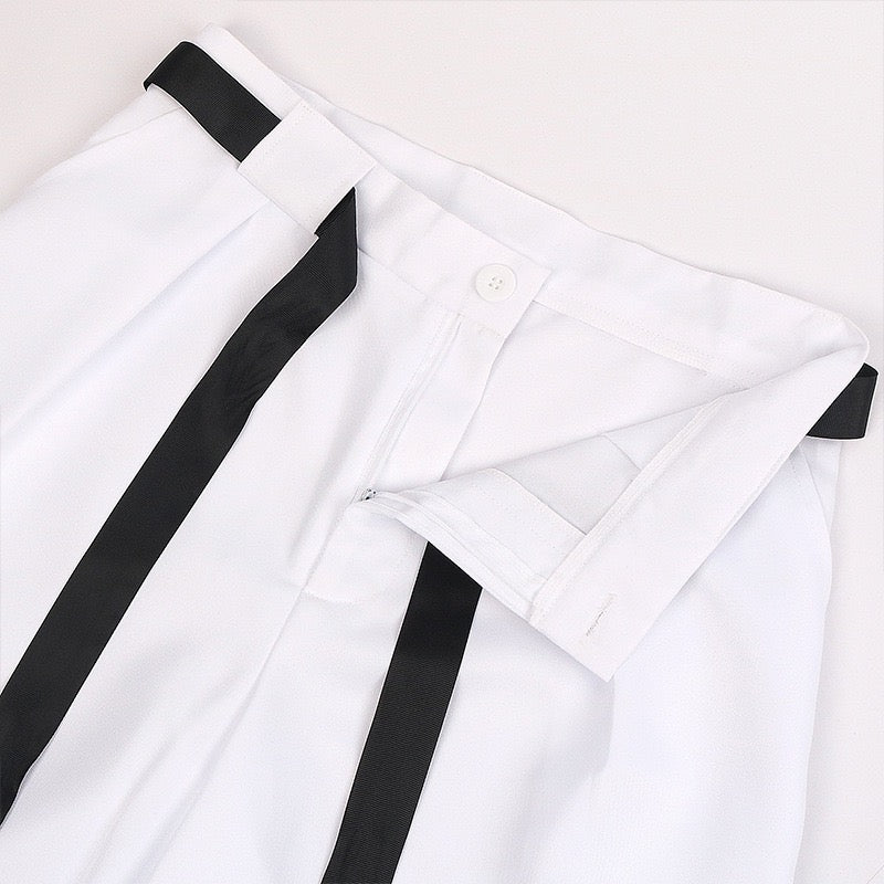 Close-up of the waistband, belt loops, and front closure on the white Toji Fushiguro cosplay pants