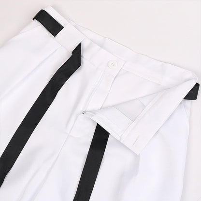 Close-up of the waistband, belt loops, and front closure on the white Toji Fushiguro cosplay pants